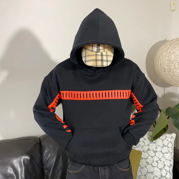 Centered Torso View of Black Hoodie Featuring Bold Orange Text Bar Graphic