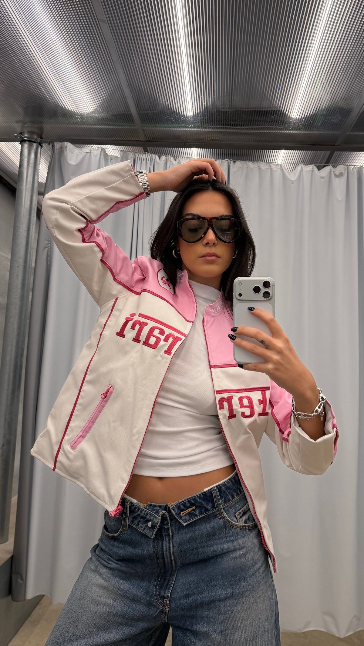 Streetwear styling of the premium Baby Pink Ferrari F1 Jacket by Streetbred on a female model, featuring a high-quality faux leather finish.