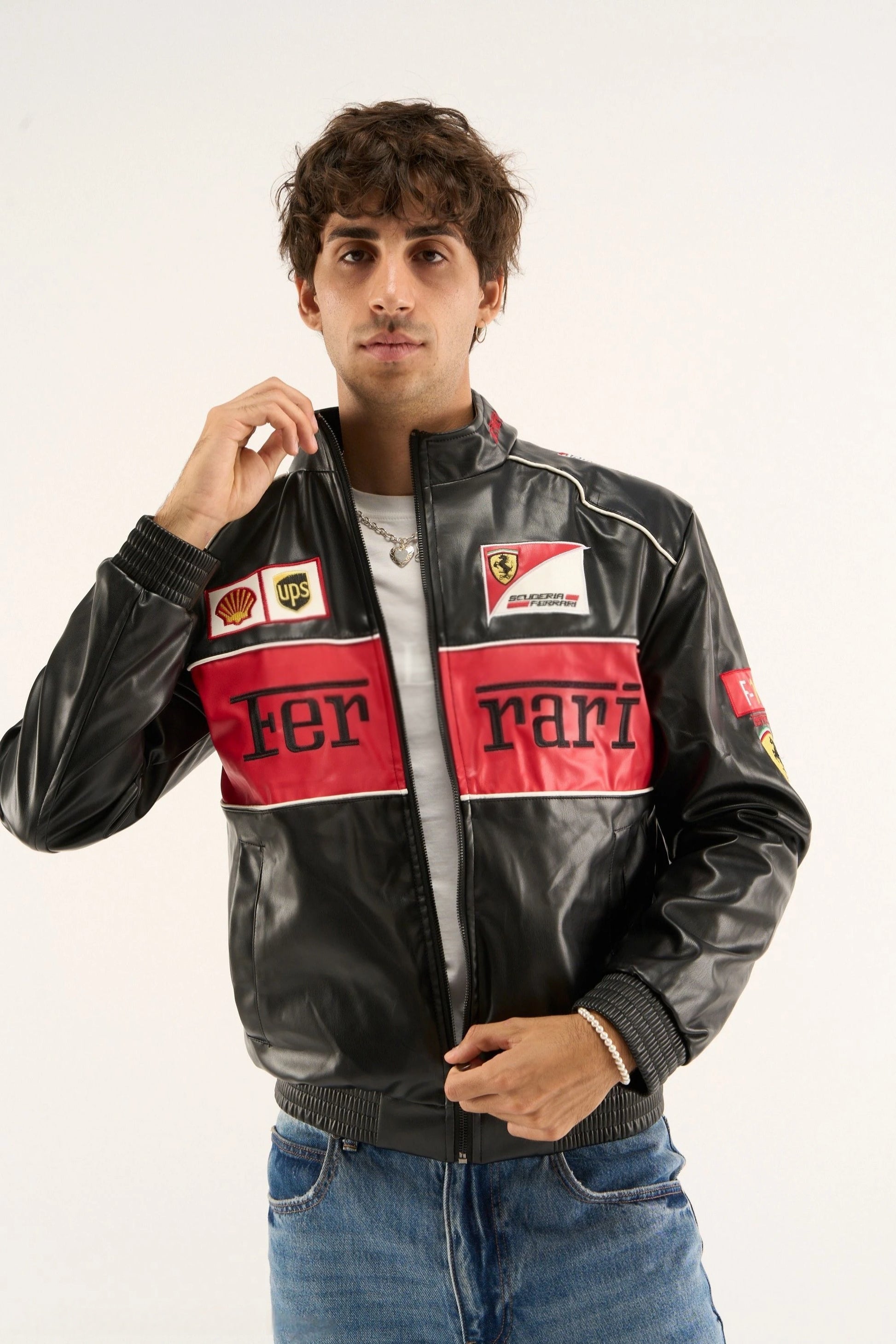 Man wearing the Black Ferrari F1 Leather Jacket by Streetbred, showing the vintage cropped bomber fit and stealth racing aesthetic.