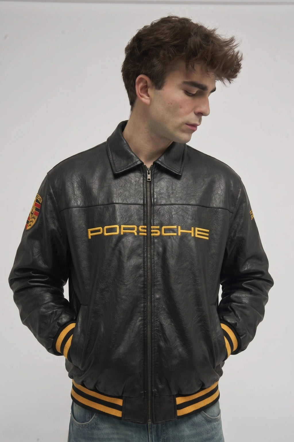 Man wearing the Black Porsche 993 Leather Jacket by Streetbred, showcasing the premium vintage racing aesthetic and oversized bomber fit.
