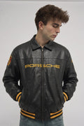 Man wearing the Black Porsche 993 Leather Jacket by Streetbred, showcasing the premium vintage racing aesthetic and oversized bomber fit.