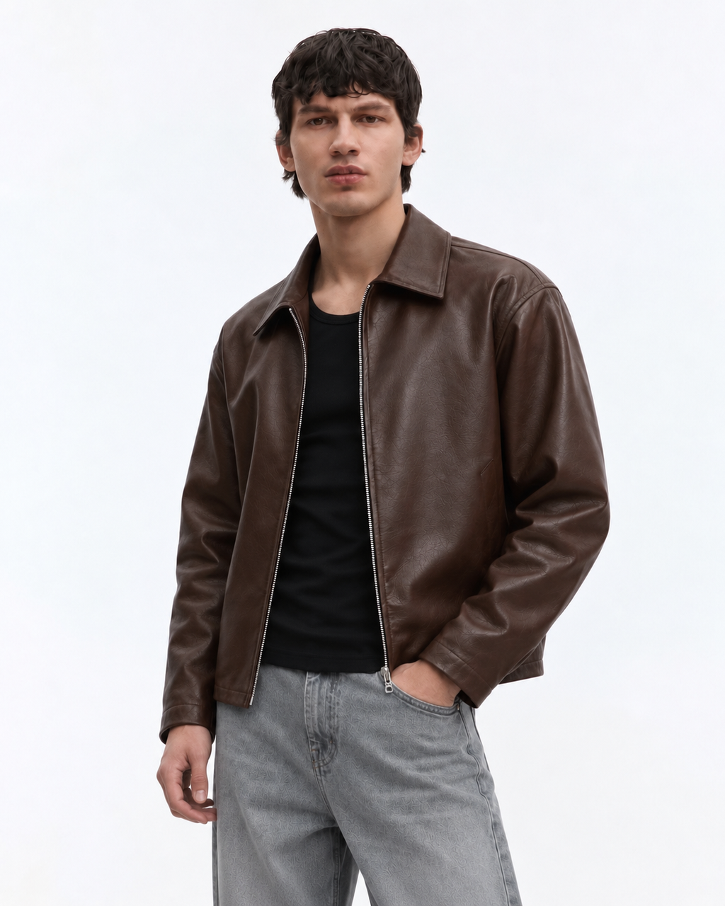 Front styling view of the male model demonstrating the relaxed classic shirt collar and wide chest drape of the retro brown jacket