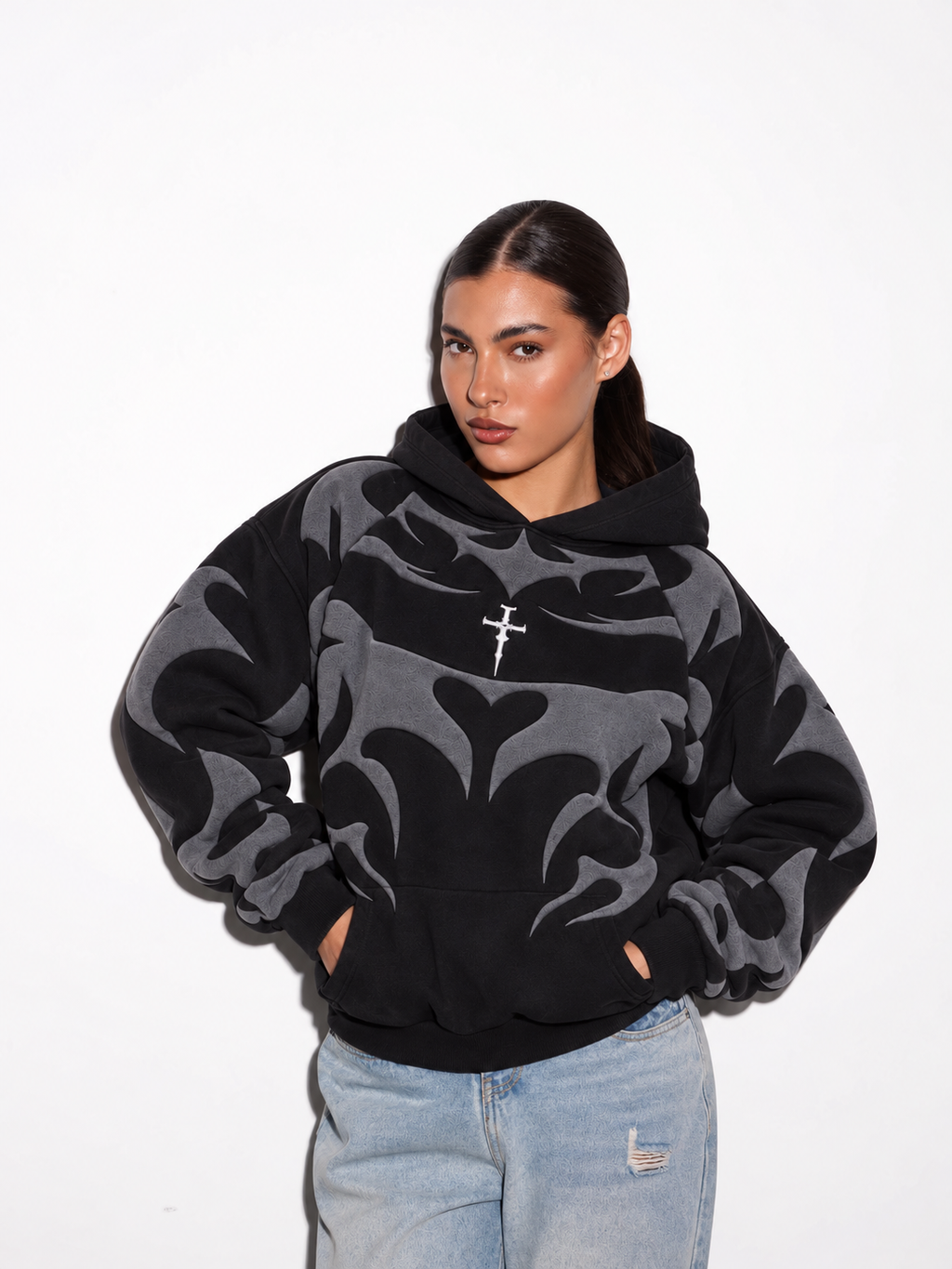 Front view of the girl wearing the black Y2K graphic hoodie, emphasizing the comfortable kangaroo pocket and clean hood.