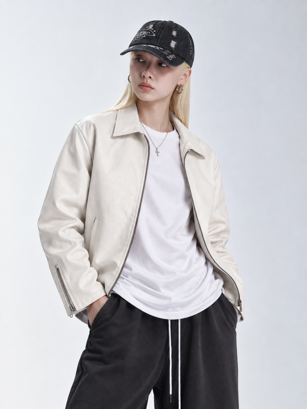Lifestyle shot of the girl in the crisp white faux leather jacket, emphasizing the traditional fold-down collar and wide chest fit