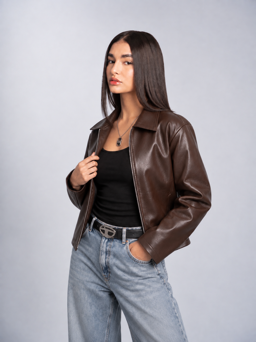 Lifestyle shot of the girl in the vintage earth-tone brown jacket, highlighting the smooth texture and relaxed oversized sleeves
