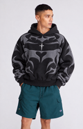 Male model wearing the black Streetbred Depth graphic hoodie, highlighting the loosefit winter drape and stringless hood