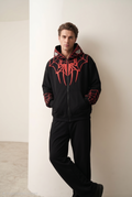 Male Model styling the Stealth Black Miles Morales Spider Hoodie
