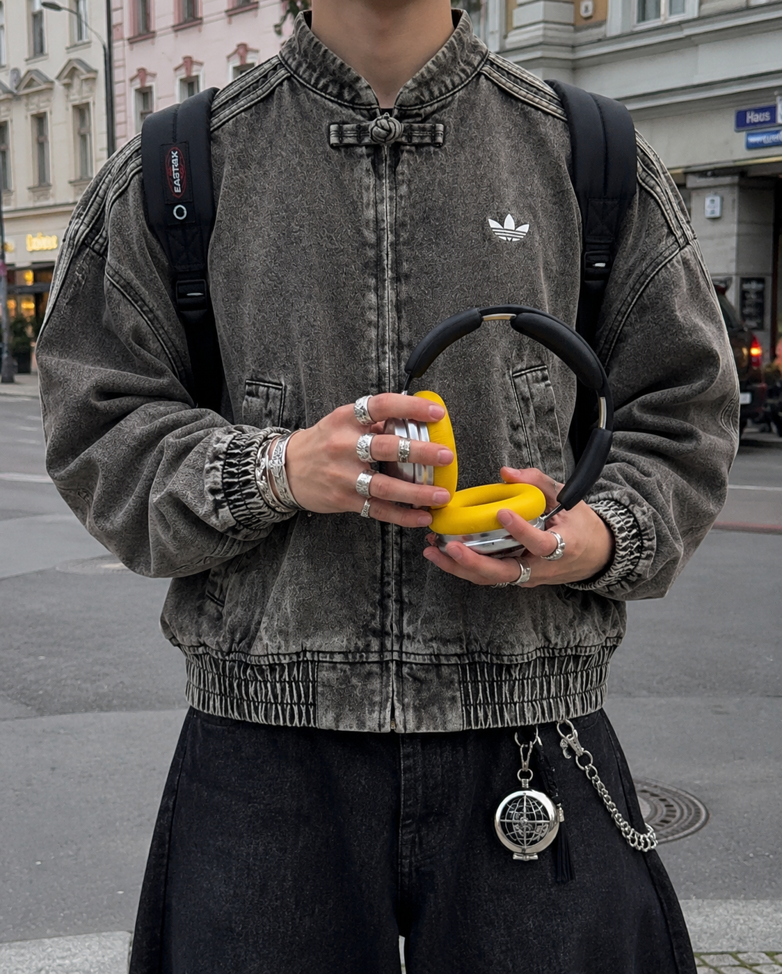 Male model styling the oversized vintage washed Denim CNY Jacket by Streetbred
