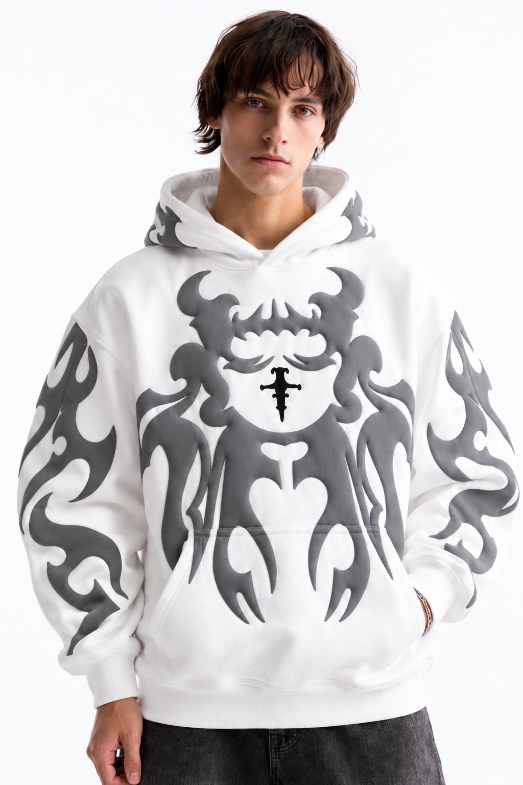 Male model wearing the crisp white Streetbred graphic hoodie, highlighting the oversized drop-shoulder fit for winter