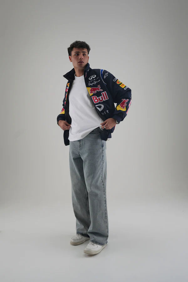 Red Bull F1 Jacket Worn Open Over White Tee with Blue Jeans - Urban Lifestyle
