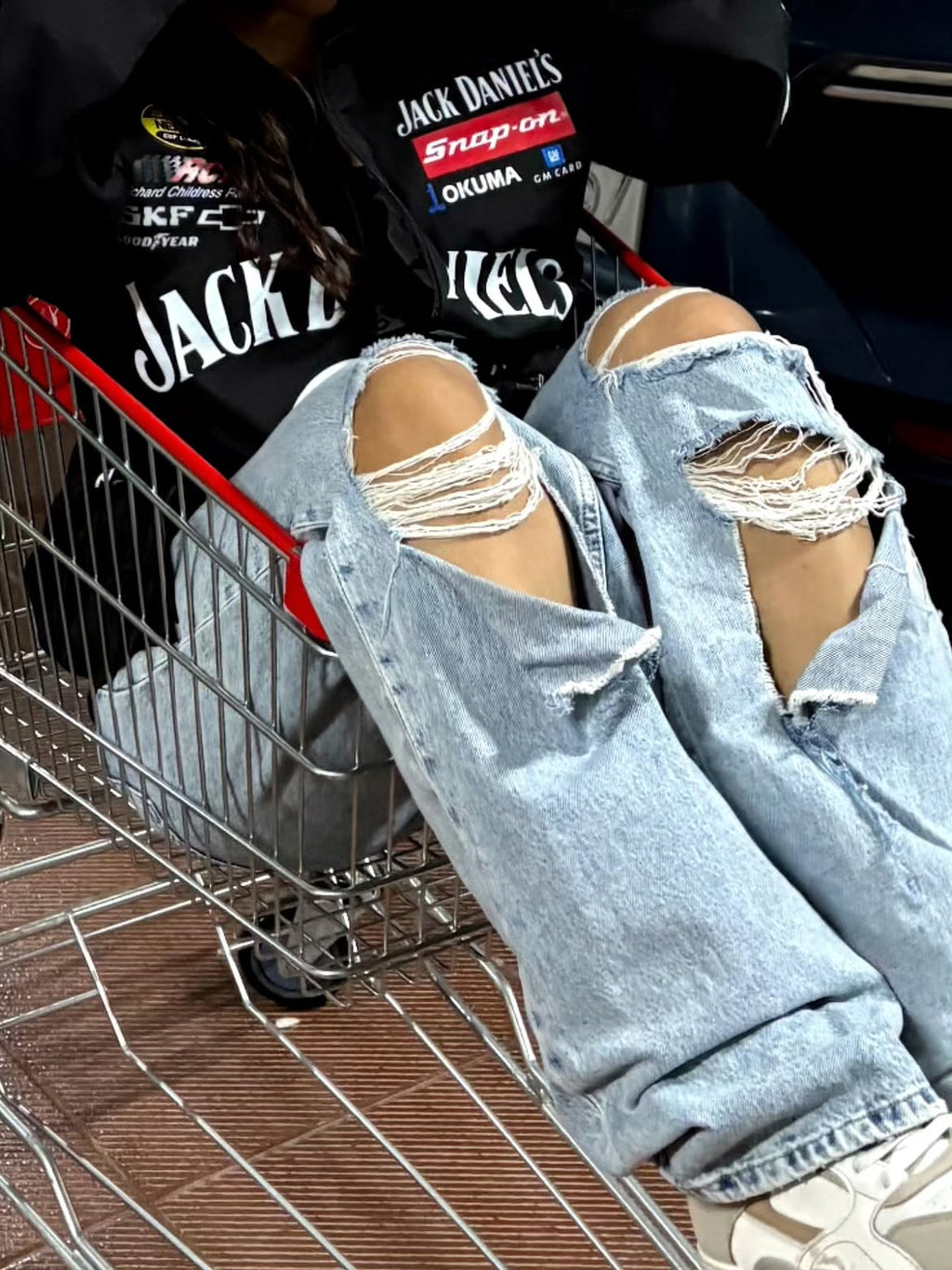 Close up details of the retro 90s racing jacket in women's streetwear fashion