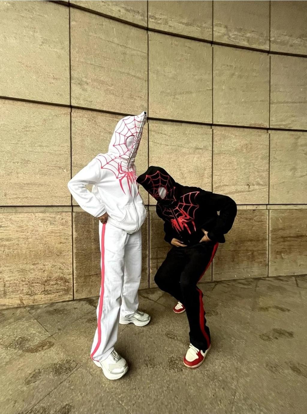 Lifestyle Streetwear Shot of matching White and Black Spiderman Zip-Up Hoodies
