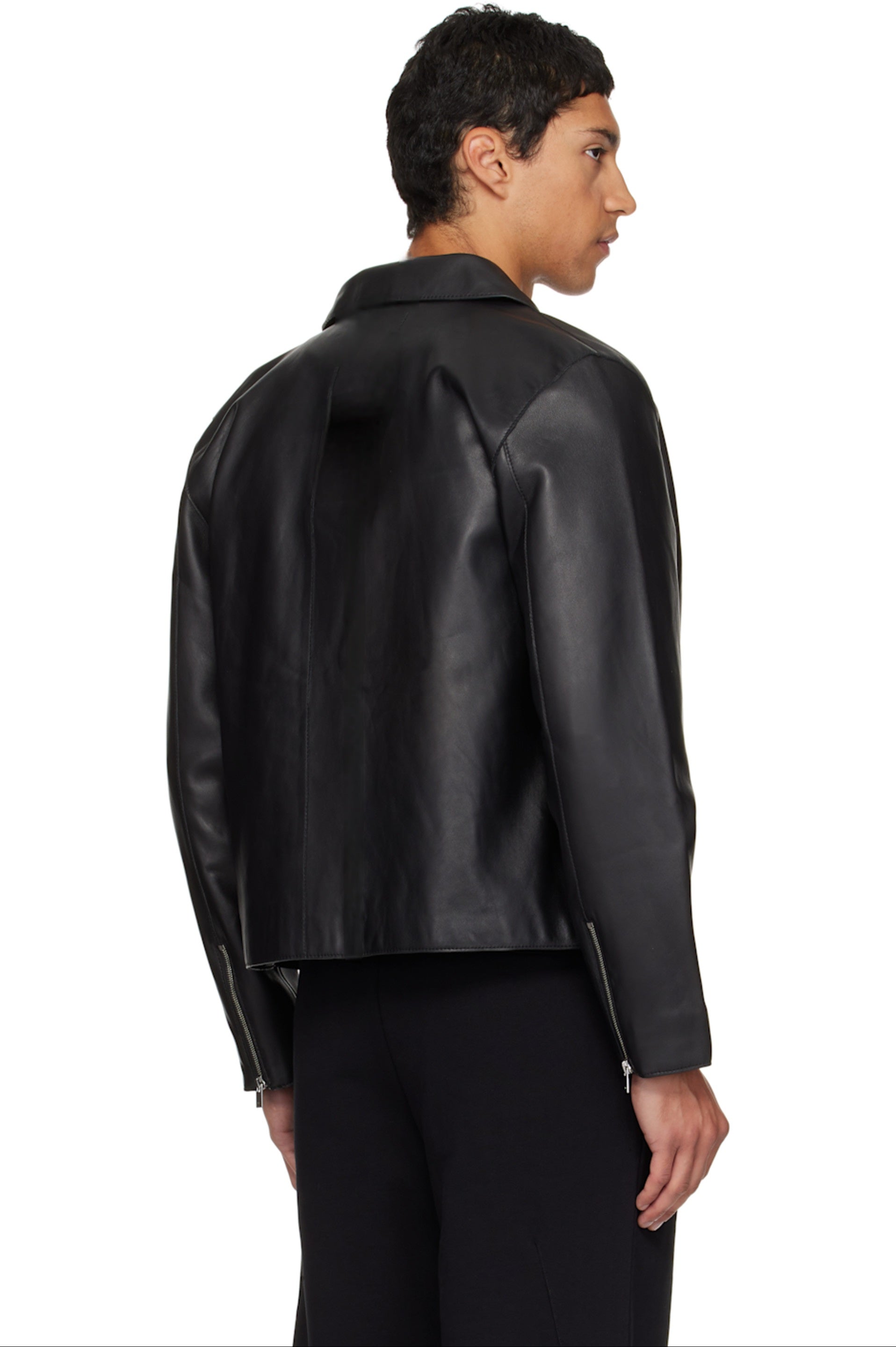 Guy Modeling an Oversized Boxy Faux Leather Jacket for Streetbred Winter Layering