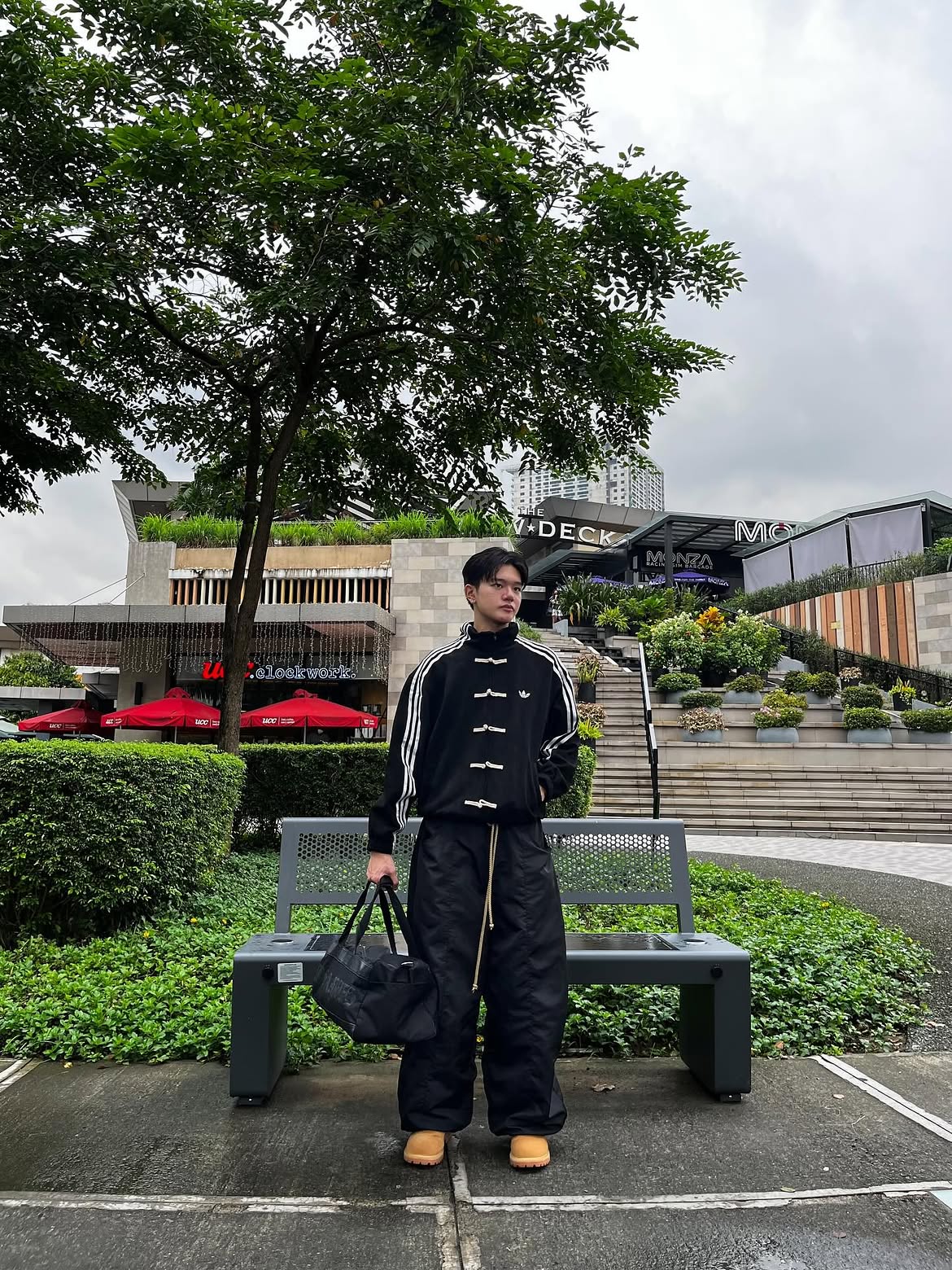 Man wearing the Black CNY Adidas Knot Jacket, demonstrating the versatile unisex oversized fit and Gen-Z track jacket styling.