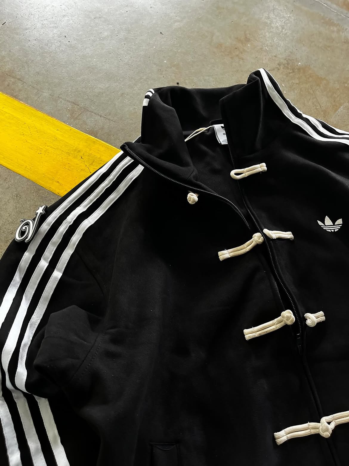 Back view mockup of the oversized Black CNY Korean Streetwear Track Jacket, featuring a clean drop and premium suede construction.
