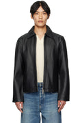 Man styling the Unisex Black Cropped Leather Jacket by Streetbred, featuring a modern boxy fit and functional dual sleeve zips