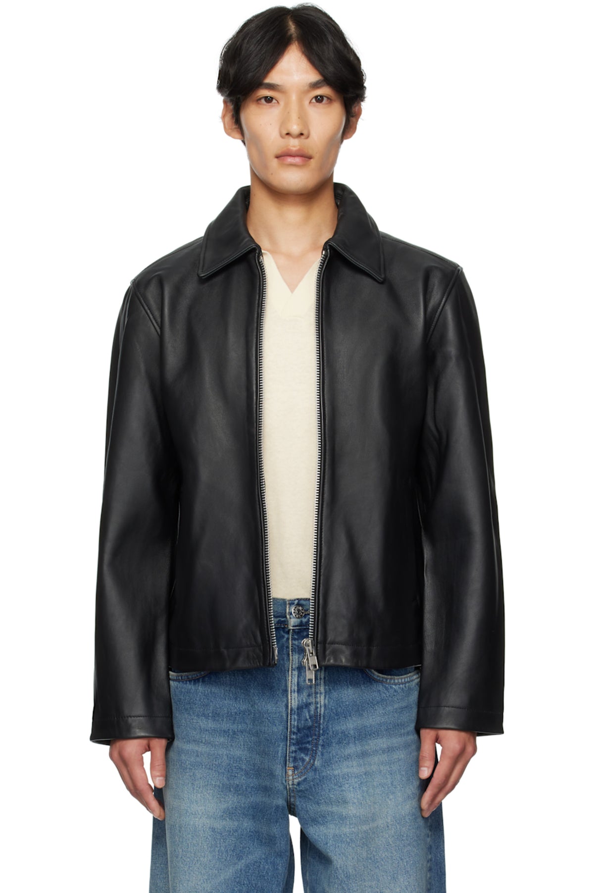 Man styling the Unisex Black Cropped Leather Jacket by Streetbred, featuring a modern boxy fit and functional dual sleeve zips