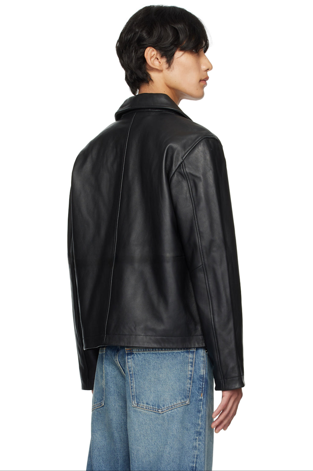 Streetwear look featuring a man in the perfect minimal leather jacket, demonstrating the wide clean shoulder drape of this cropped outerwear
