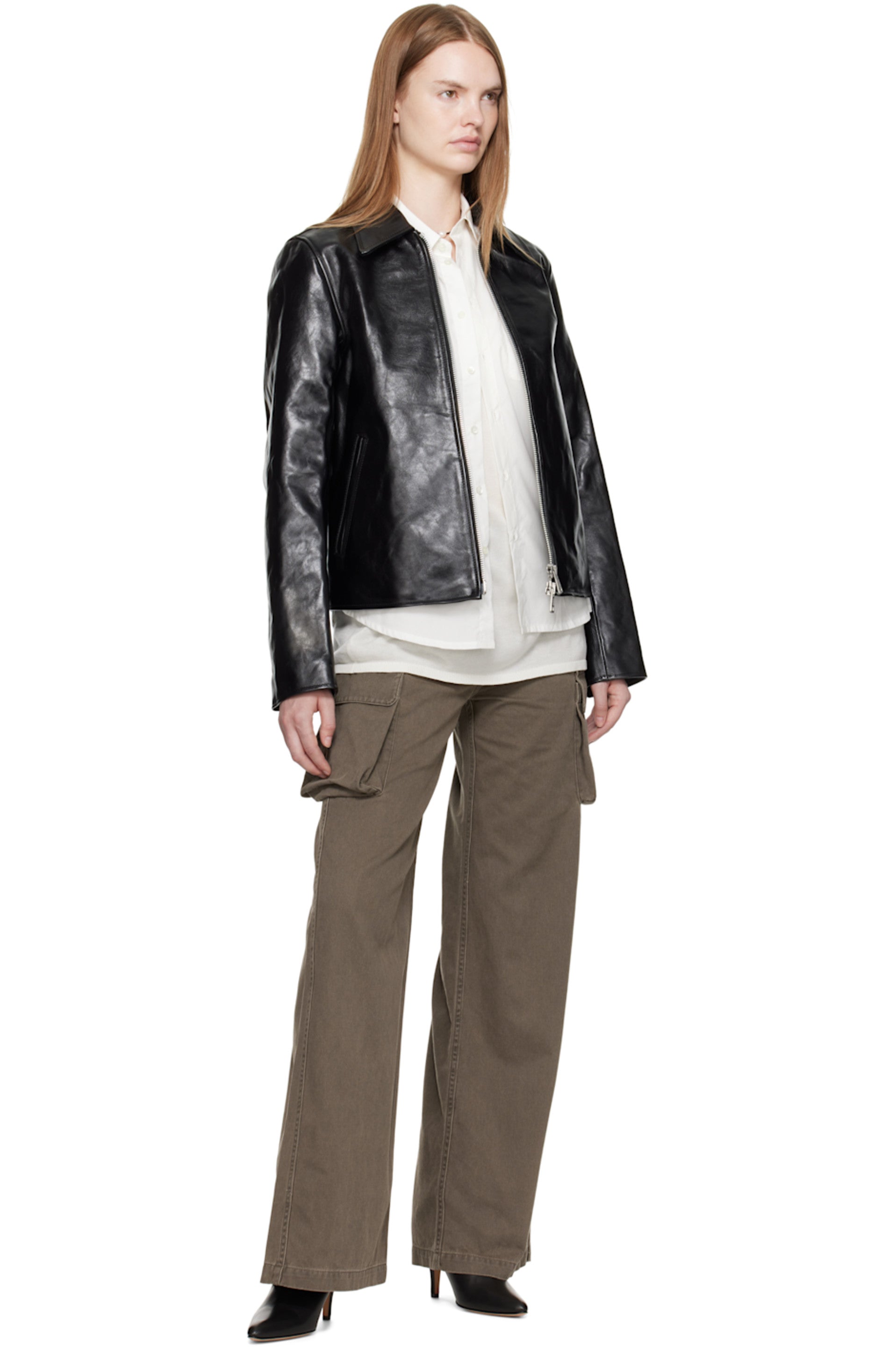 Alt Text: Woman wearing the Unisex Black Cropped Leather Jacket, highlighting the flawless Y2K cropped waist and boxy proportions