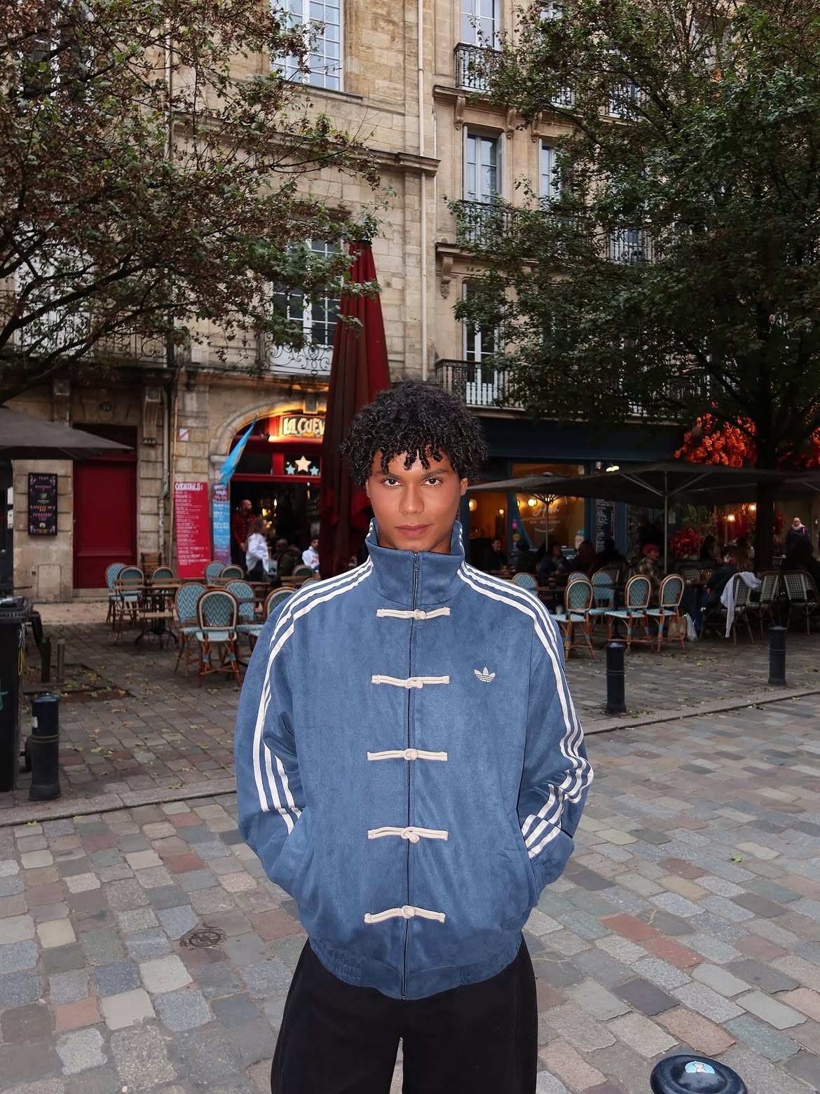 Man wearing the Unisex Navy Blue CNY Adidas Jacket, highlighting the versatile boxy fit perfect for layering in winter streetwear.
