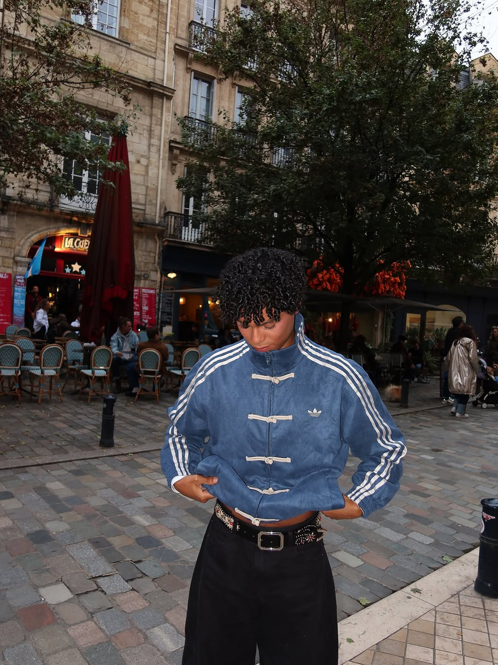 Front view of the limited edition Adidas CNY Knot Jacket on a male model, showcasing the heritage symbolism mixed with modern street luxury.