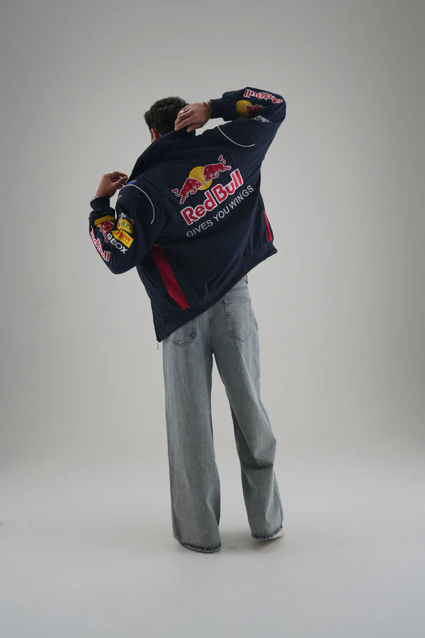 Red Bull Racing Jacket Draped Off Shoulders Showing Gives You Wings Back Design
