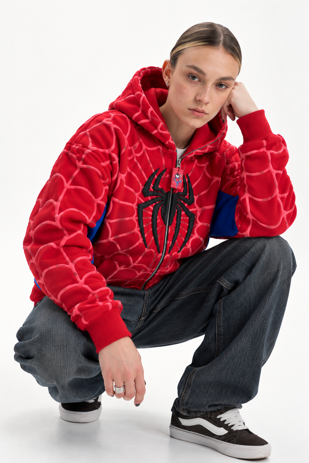 Close up view of the woman wearing the black heavyweight fleece Marvel hoodie, showing the front split kangaroo pocket