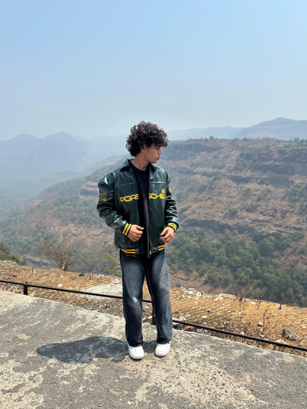 Model off-duty look with women's oversized vintage racing jacket green
